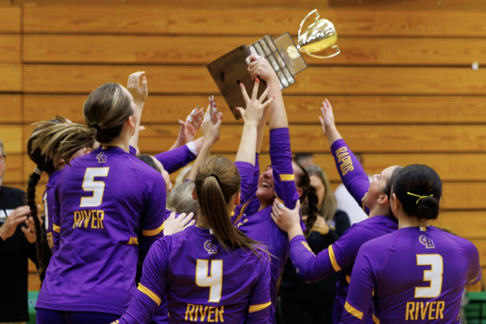 Columbia River Volleyball team celebrating on the court